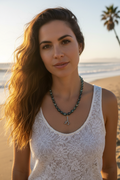 Woman wearing necklace on California beach
